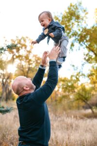 Shane R. Christensen Playing with son Colt
